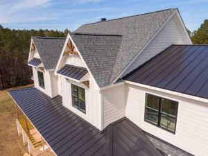 Homeowners reviewing roof replacement documents and monthly payment figures at a kitchen table.